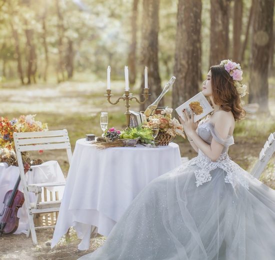 Bride sitting on a chair in the forest