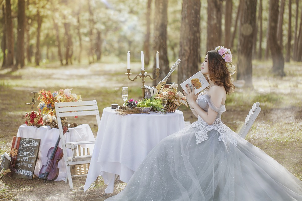 Bride sitting on a chair in the forest