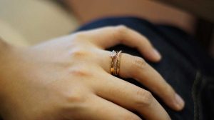 Stackable wedding ring on Bride's finger
