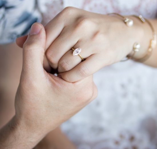 Bride wearing marquise cut engagement ring