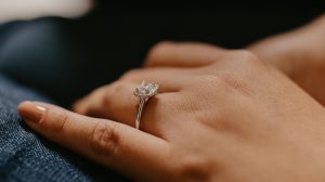Square shape diamond engagement ring on girl's finger