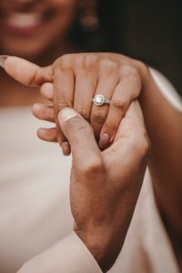 Girl wearing white stone engagement ring