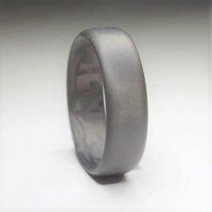 Carbon fiber wedding ring close up