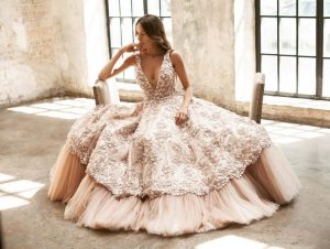 Bride wearing floral applique wedding gown