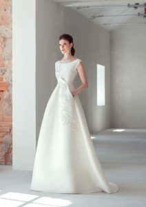 Ivory wedding dress: bride wearing