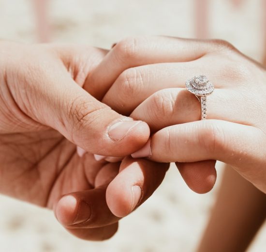 Bride holding grooms hand
