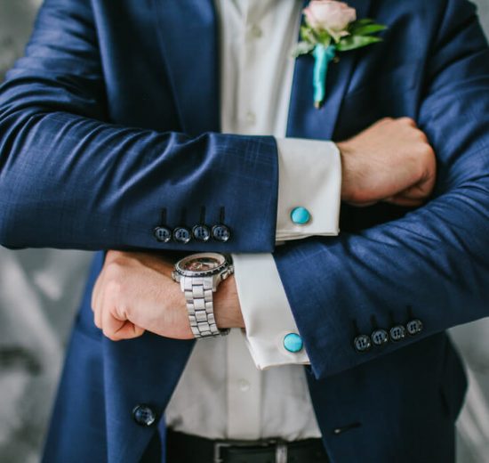 Groom showing off his cufflinks