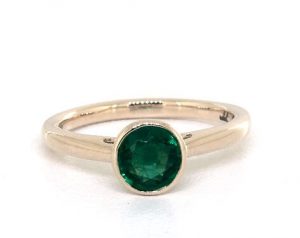 Bezel set green emerald engagement ring