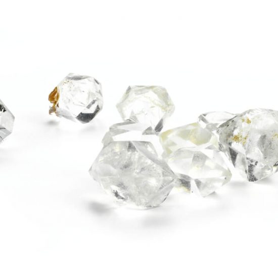 Gemstones that look like diamond on white background closeup