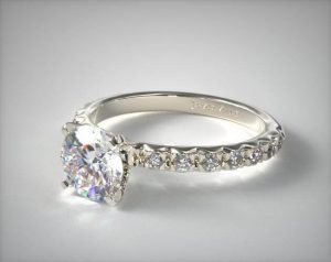 French pave engagement ring with round shape diamond