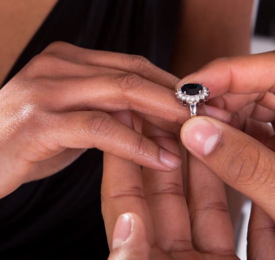 Bride trying black diamond engagement ring on