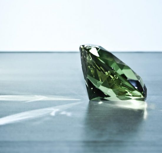 Green diamond round shape in blue background