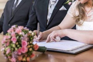 signing wedding couple
