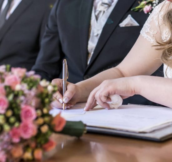 signing wedding couple
