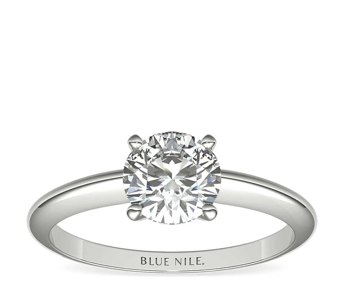 Solitaire setting colorless diamond engagement ring