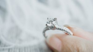 Holding a diamond ring with thick girdle