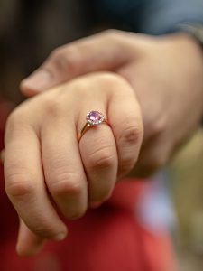 pink gemstone ring couple hand