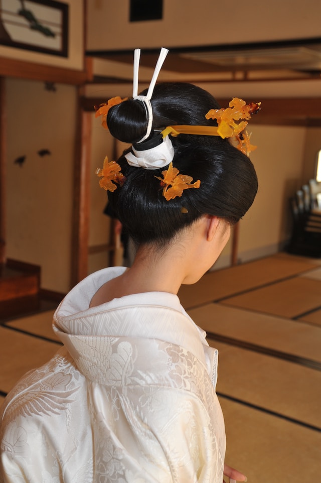 a woman wearing wedding kimono and hairstyle