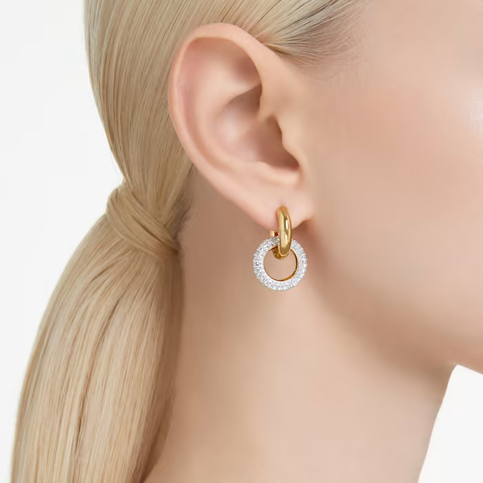 interlocking hoop earring on the woman's ear